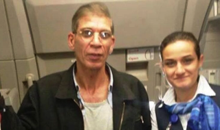 Photo of hijacker Seifedeen Mustafa with a flight attendant (Newsweek)